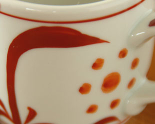 砥部焼・梅山窯　赤太陽のコーヒーカップの絵柄